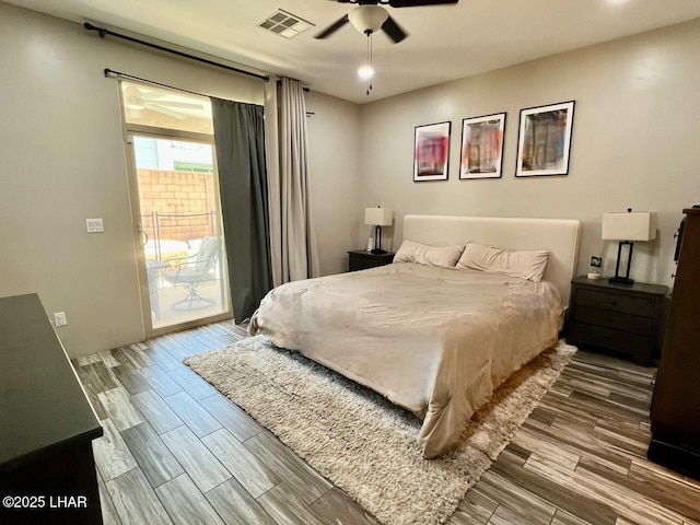 1737 E Alder Cir, Lake Havasu City, AZ 86404 - bedroom featuring access to exterior, wood finished floors, and ceiling fan
