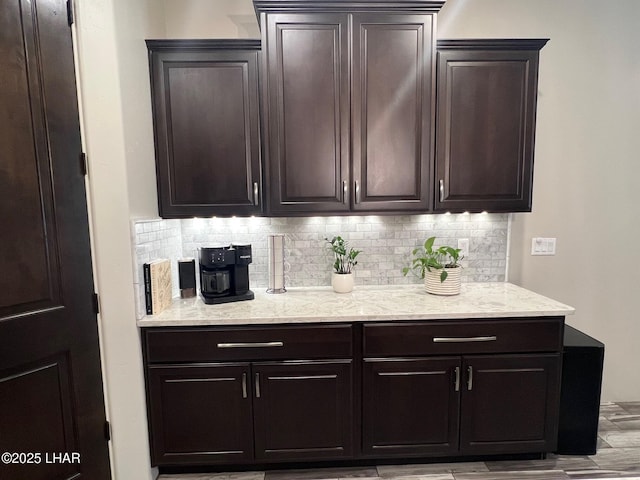 1737 E Alder Cir, Lake Havasu City, AZ 86404 - bar area featuring tasteful backsplash and wood finished floors