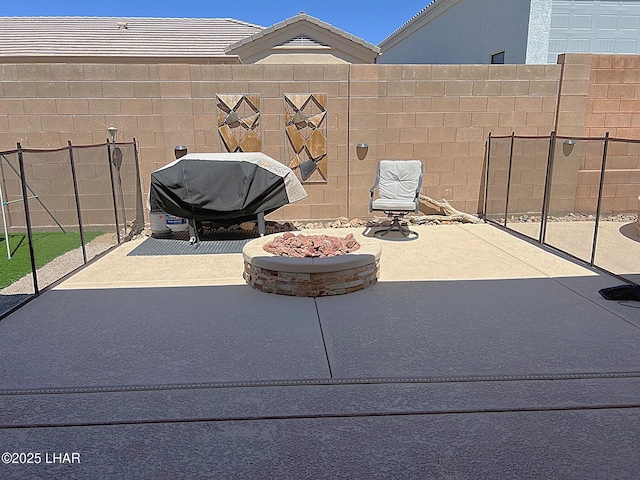 1737 E Alder Cir, Lake Havasu City, AZ 86404 - view of patio / terrace featuring fence, a fire pit, and area for grilling