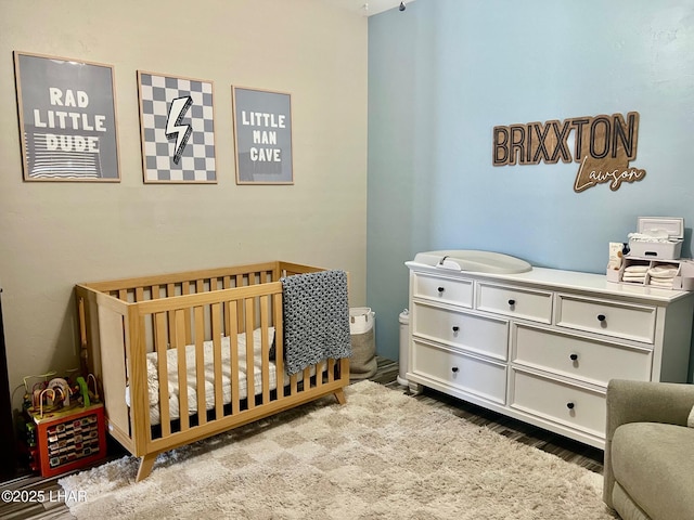 1737 E Alder Cir, Lake Havasu City, AZ 86404 - bedroom with a crib and wood finished floors