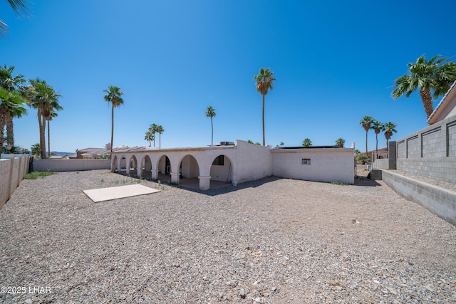 2340 Jamaica Blvd S, Lake Havasu City, AZ 86406 - back of house with a fenced backyard, stucco siding, and a patio area