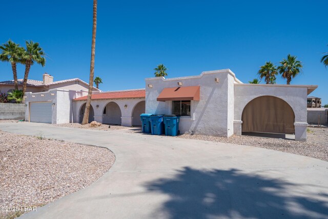 2340 Jamaica Blvd S, Lake Havasu City, AZ 86406 - mediterranean / spanish house with stucco siding, driveway, a garage, and a tile roof