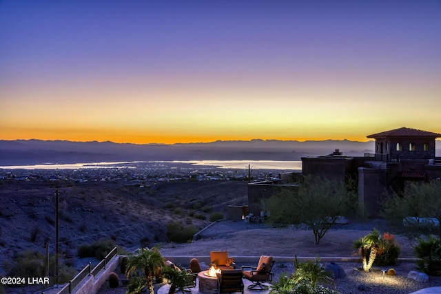 exterior space with an outdoor fire pit and a mountain view