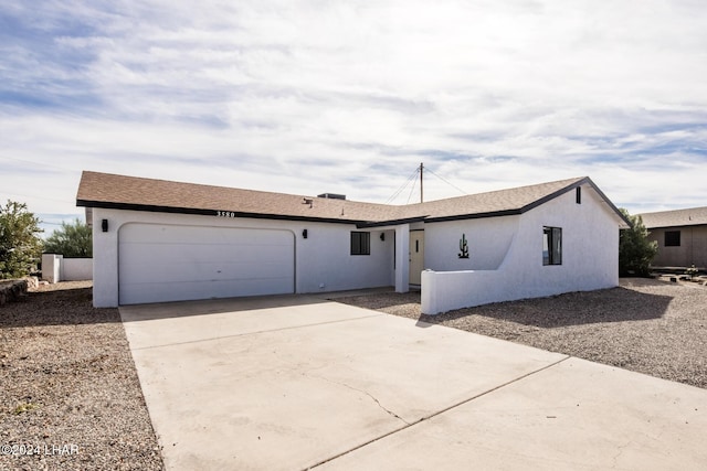 ranch-style home with a garage