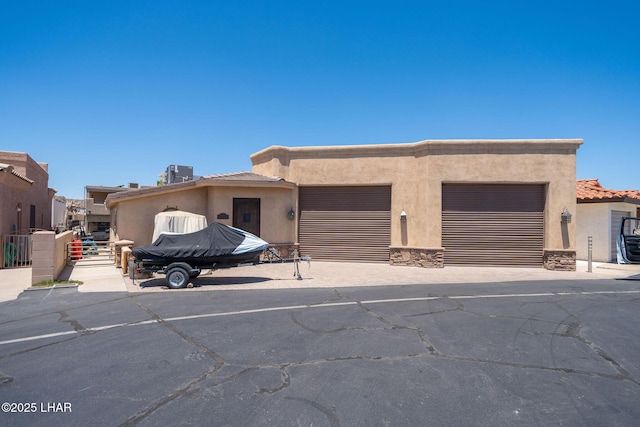 8874 Papago Loop, Parker, AZ 85344 - view of front facade featuring stucco siding, an attached garage, driveway, and a tile roof