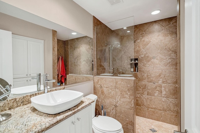 8874 Papago Loop, Parker, AZ 85344 - bathroom featuring a walk in shower, vanity, and tile walls