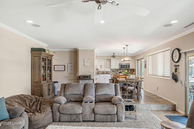8874 Papago Loop, Parker, AZ 85344 - living room featuring a ceiling fan, ornamental molding, and recessed lighting