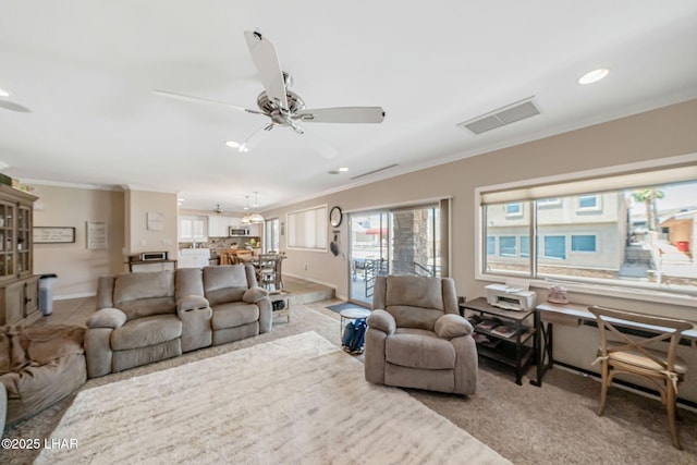 8874 Papago Loop, Parker, AZ 85344 - living area featuring ornamental molding, a ceiling fan, healthy amount of natural light, and recessed lighting