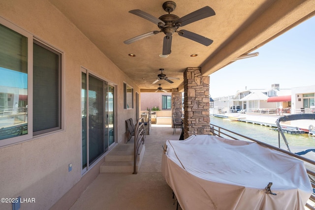 8874 Papago Loop, Parker, AZ 85344 - view of patio / terrace featuring a water view and a ceiling fan