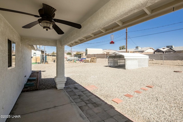 view of patio / terrace with a fenced backyard and ceiling fan