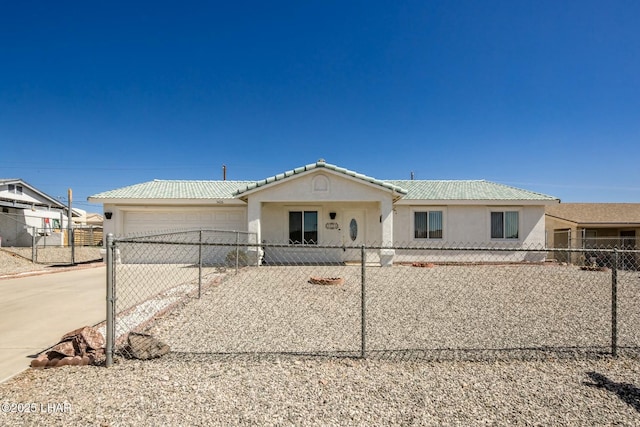 view of front of house featuring a fenced front yard, a garage, concrete driveway, and stucco siding