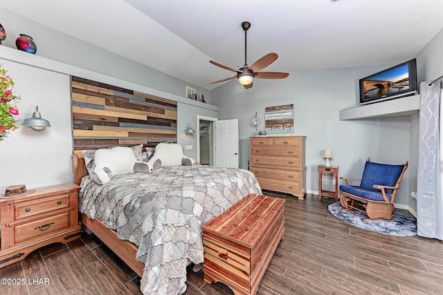 bedroom featuring vaulted ceiling, ceiling fan, and wooden walls