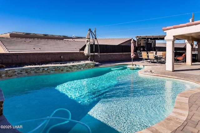 view of pool with a patio area