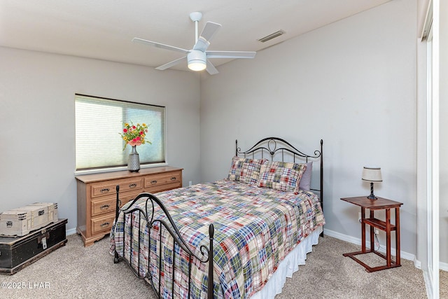 bedroom with light carpet and ceiling fan