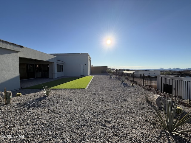 view of yard featuring a mountain view and a patio area