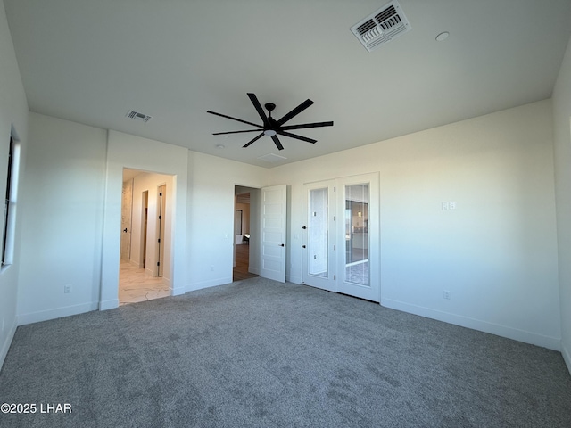 unfurnished bedroom featuring carpet and ceiling fan