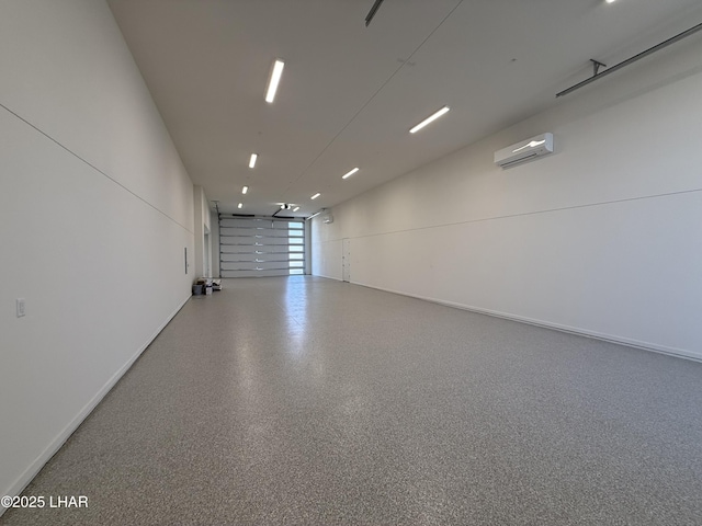 garage featuring an AC wall unit