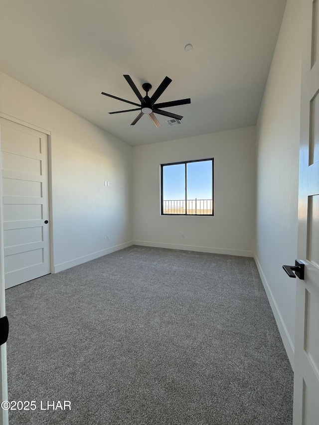 spare room with carpet flooring and ceiling fan