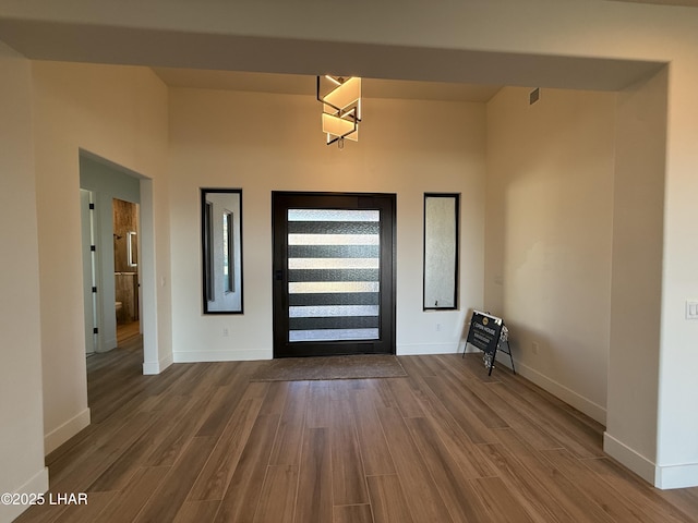 entryway with hardwood / wood-style floors