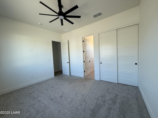 unfurnished bedroom with ceiling fan, a closet, and carpet