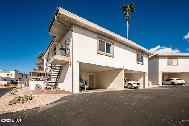 1824 Montana Vis Unit D, Lake Havasu City, AZ 86403 - exterior space with stairway, a carport, and stucco siding