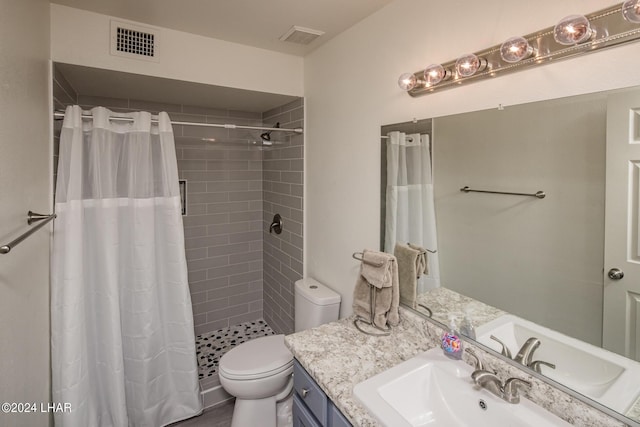 bathroom with vanity, toilet, and a shower with shower curtain