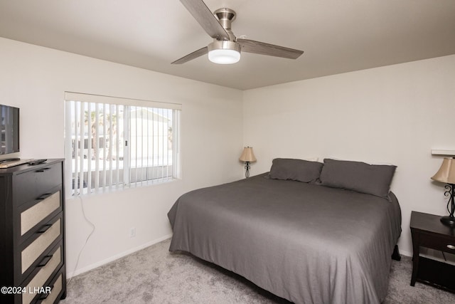 bedroom featuring ceiling fan and light carpet