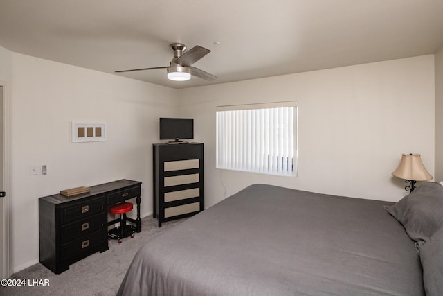 bedroom featuring light carpet and ceiling fan