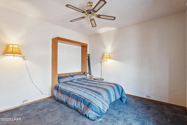 carpeted bedroom featuring ceiling fan and baseboards