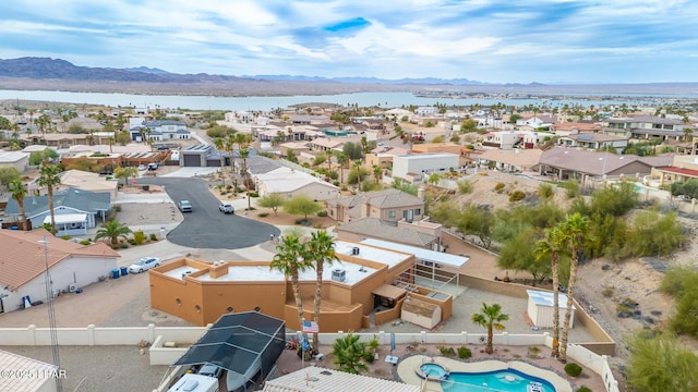 bird's eye view with a residential view and a water and mountain view