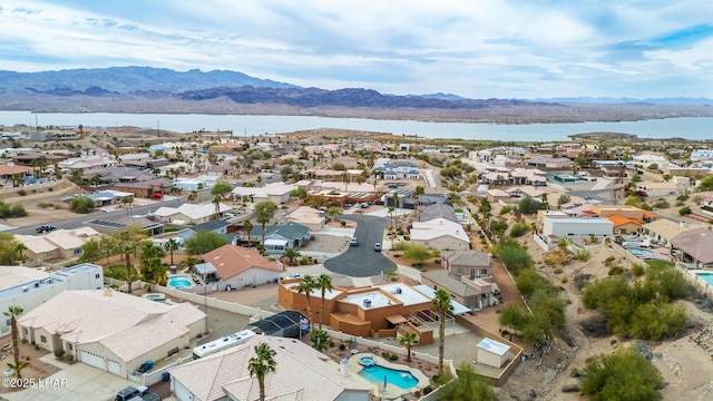 aerial view with a residential view and a water and mountain view