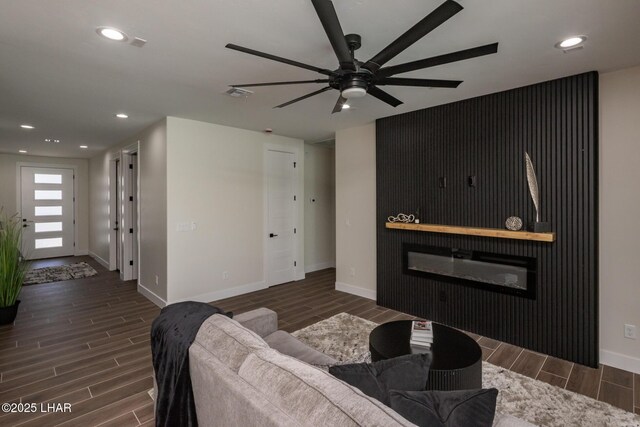 2185 Palo Verde Blvd S, Lake Havasu City, AZ 86403 - living room featuring wood finish floors, a ceiling fan, a glass covered fireplace, and recessed lighting