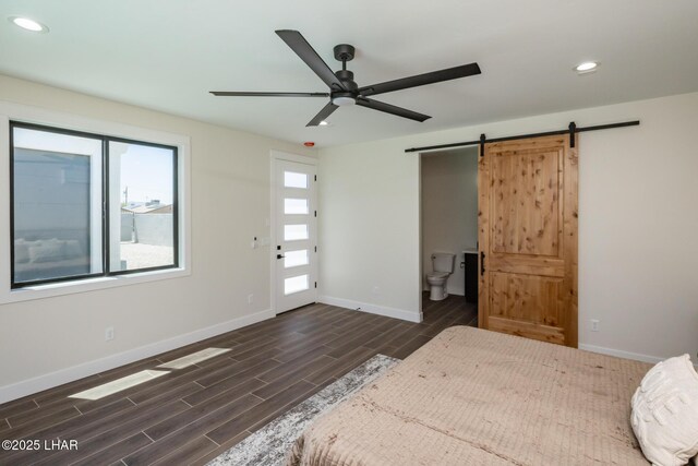 2185 Palo Verde Blvd S, Lake Havasu City, AZ 86403 - bedroom with a barn door, dark wood-style flooring, recessed lighting, ensuite bathroom, and ceiling fan
