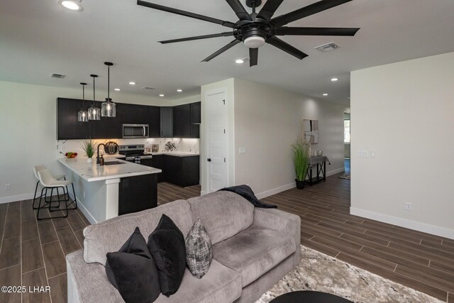 2185 Palo Verde Blvd S, Lake Havasu City, AZ 86403 - living area featuring wood tiled floors, recessed lighting, and a ceiling fan