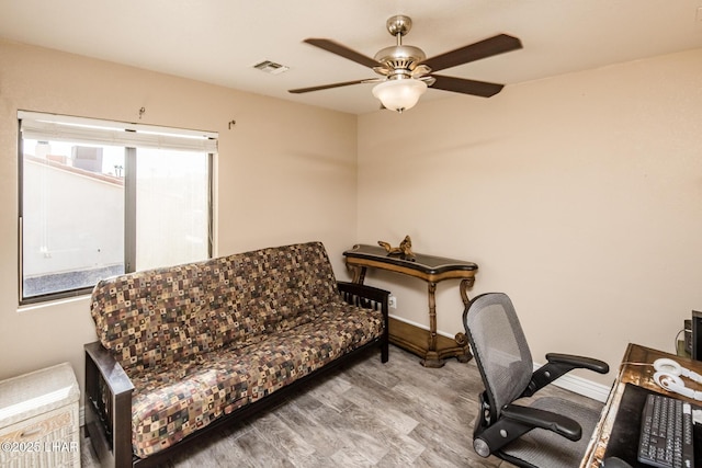 office area with hardwood / wood-style floors and ceiling fan