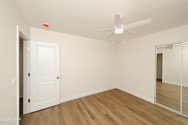 2529 Sunchief Ln, Lake Havasu City, AZ 86403 - unfurnished bedroom with light wood-type flooring, baseboards, a closet, and a ceiling fan