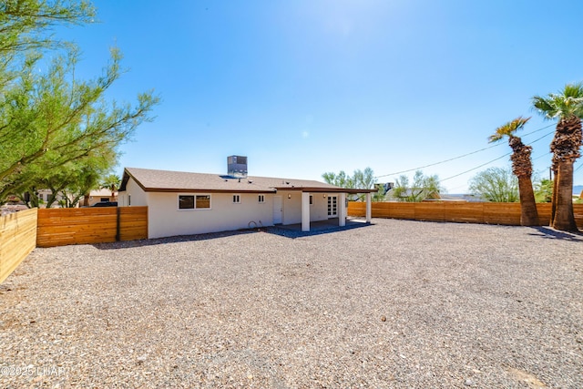 2529 Sunchief Ln, Lake Havasu City, AZ 86403 - back of property with a fenced backyard, stucco siding, and a patio