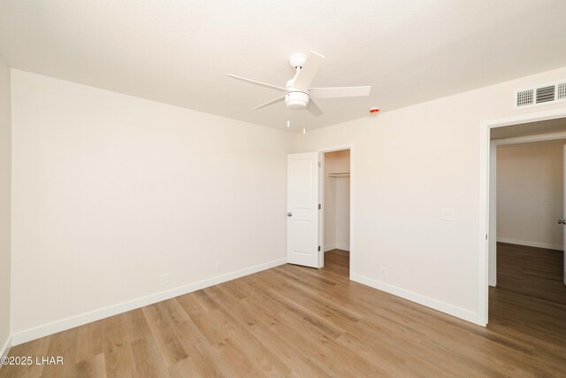 2529 Sunchief Ln, Lake Havasu City, AZ 86403 - unfurnished bedroom featuring light wood-type flooring, baseboards, a closet, and a ceiling fan