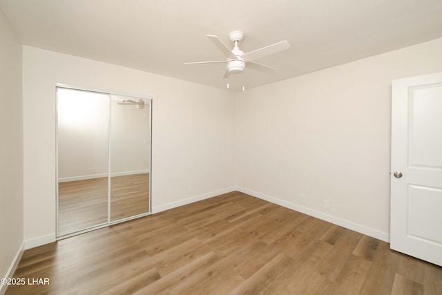 2529 Sunchief Ln, Lake Havasu City, AZ 86403 - unfurnished bedroom with wood finished floors, a closet, baseboards, and ceiling fan