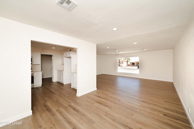 2529 Sunchief Ln, Lake Havasu City, AZ 86403 - unfurnished living room with recessed lighting, light wood finished floors, baseboards, and a ceiling fan