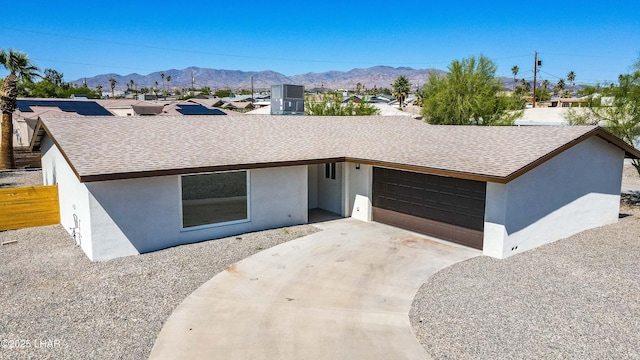 2529 Sunchief Ln, Lake Havasu City, AZ 86403 - single story home featuring stucco siding, roof with shingles, a mountain view, and a garage