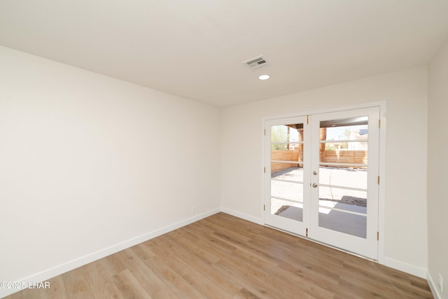 2529 Sunchief Ln, Lake Havasu City, AZ 86403 - spare room featuring french doors, baseboards, light wood finished floors, and recessed lighting