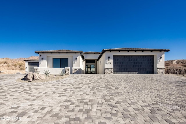 view of front of property with a garage