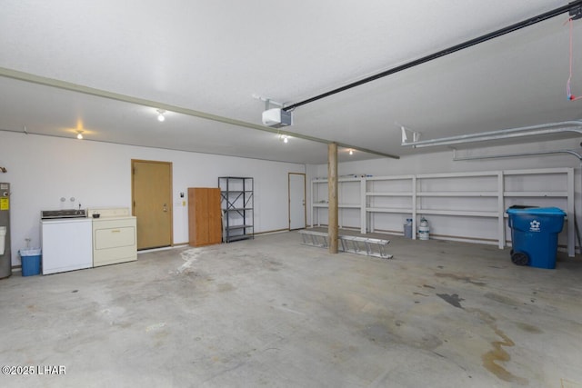 garage with a garage door opener, washing machine and dryer, and electric water heater