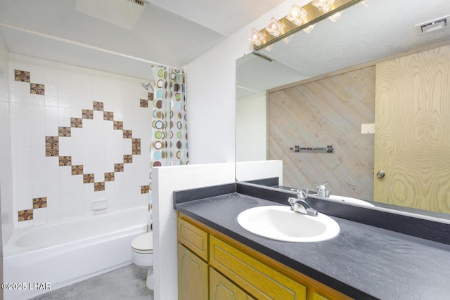 full bath with visible vents, shower / bath combo with shower curtain, toilet, and vanity