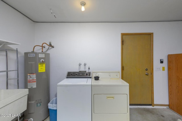 laundry area with independent washer and dryer, laundry area, a sink, and electric water heater