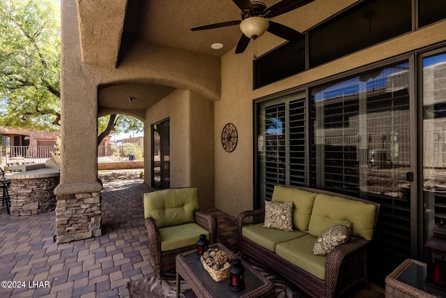 view of patio / terrace with a ceiling fan and an outdoor hangout area