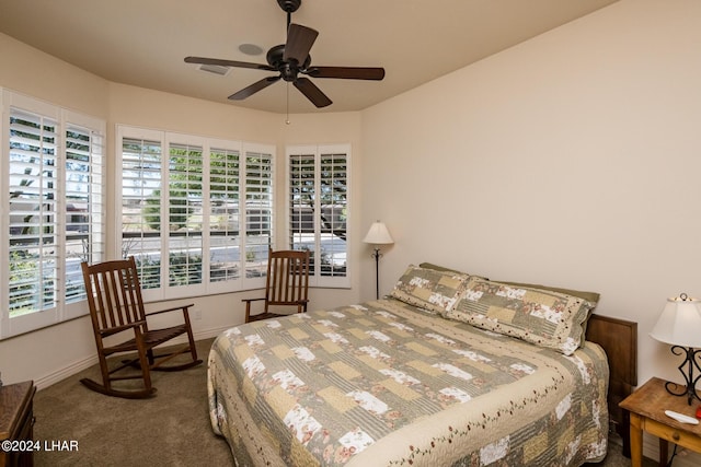 bedroom with visible vents, baseboards, carpet, and ceiling fan