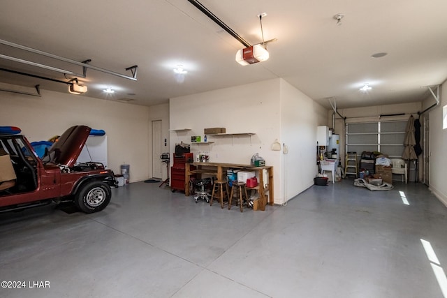 garage with a workshop area and a garage door opener