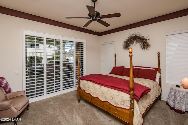 carpeted bedroom featuring ceiling fan and access to exterior